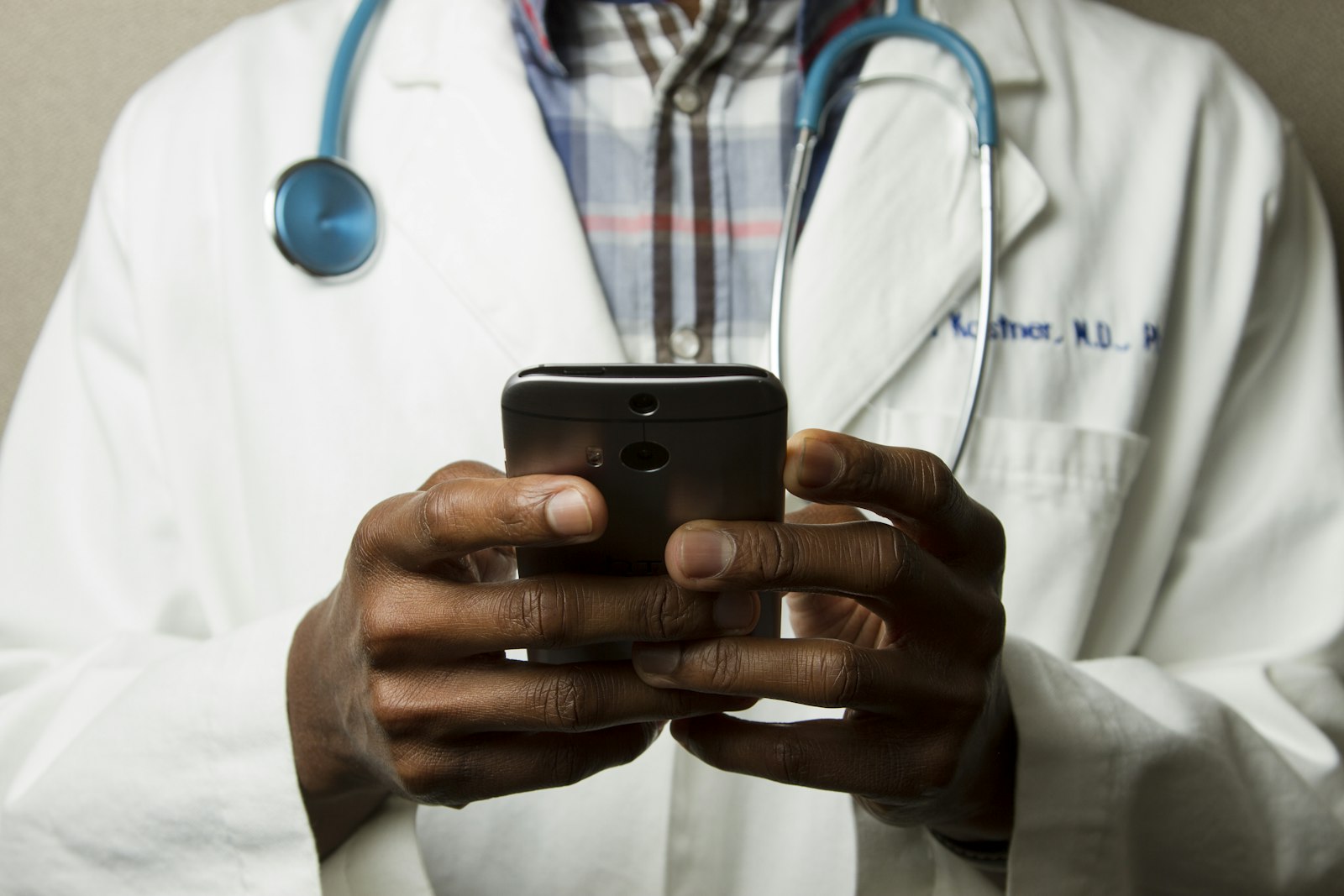 Clinician reviewing patient information on a tablet