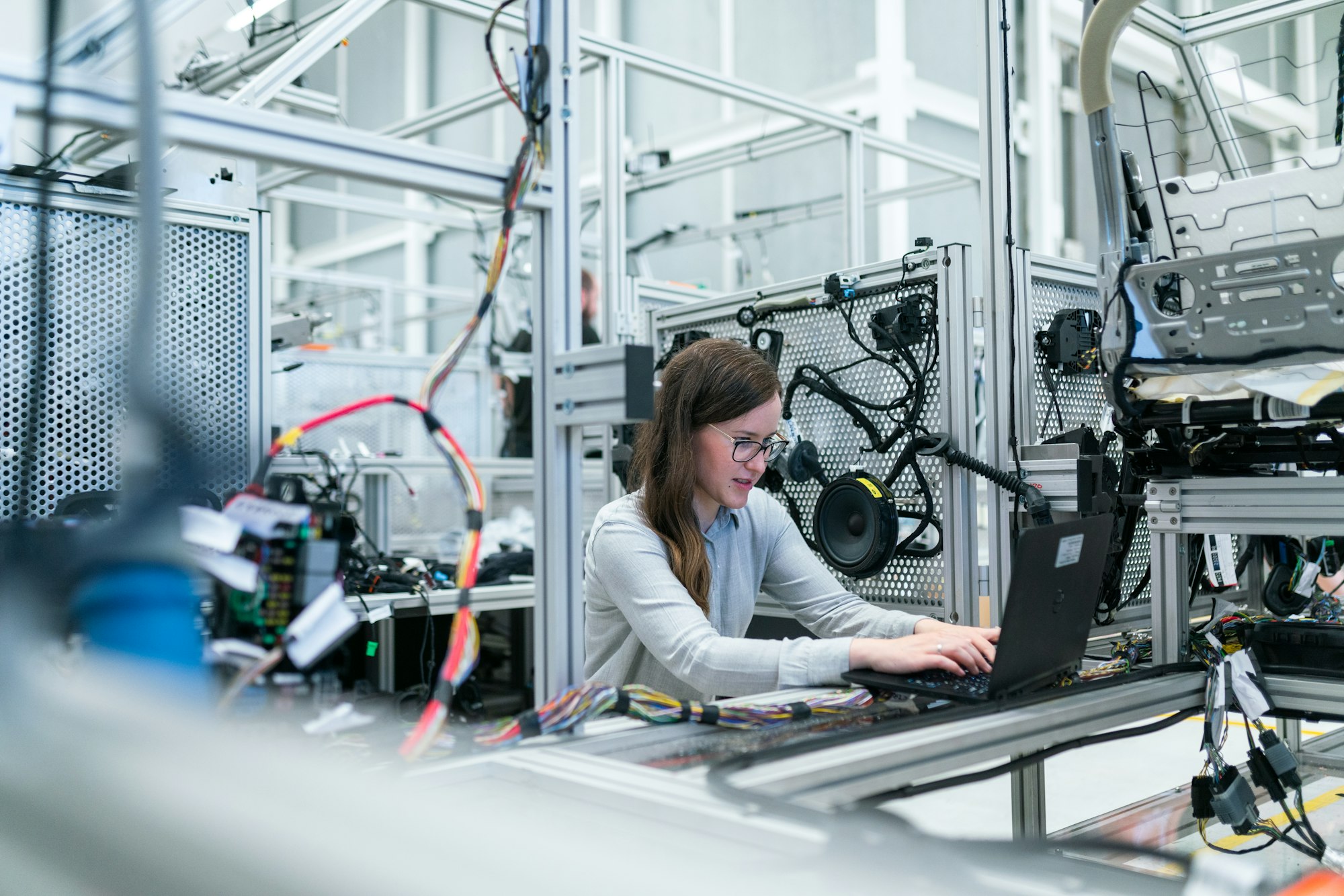 Engineer working with a laptop on a production floor