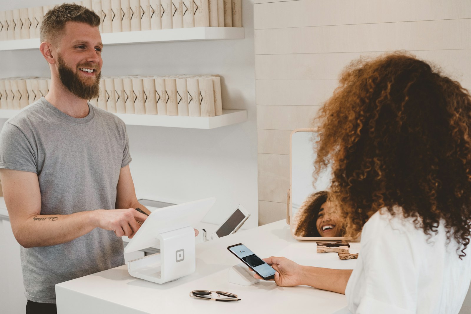 Customer completing a purchase at a retail checkout